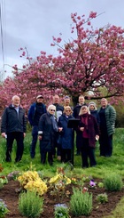 Memorial Garden..bench will sit where the people are standing