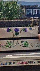 Children reading in Skelmorlie Community Garden