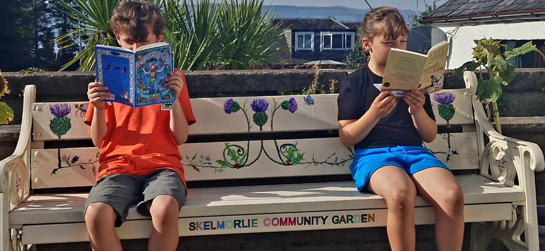 Children reading in Skelmorlie Community Garden